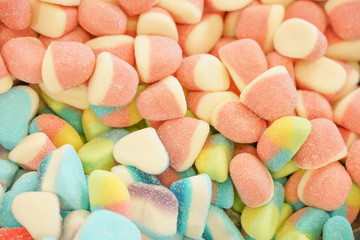 delicious multi-colored fruit marmalade. unhealthy bright candies in bulk. different jelly photo close. tasty sweets in the candy shop. nobody. 