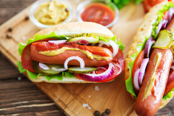 Delicious fast food. homemade hot dogs on wooden background