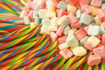 delicious multi-colored fruit marmalade. unhealthy bright candies in bulk. different jelly photo close. tasty sweets in the candy shop. nobody. 