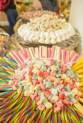 delicious multi-colored fruit marmalade. unhealthy bright candies in bulk. different jelly photo close. tasty sweets in the candy shop. nobody. 