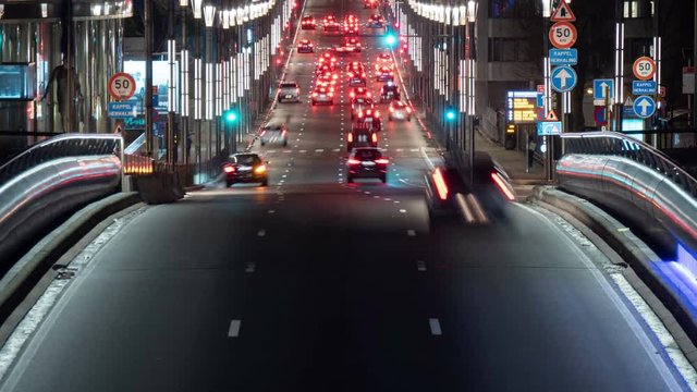 Beautiful highway with lit streets and dashing cars in Brussels in timelapse   