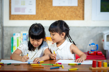 Preschooler child girl drawing and coloring