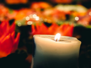 A wax or tallow with a central wick that is lit to produce light as it burns. Many burning candles...