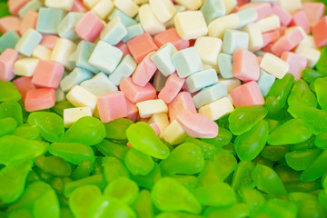 delicious multi-colored fruit marmalade. unhealthy bright candies in bulk. different jelly photo close. tasty sweets in the candy shop. nobody. 