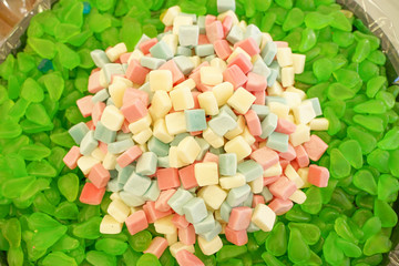 delicious multi-colored fruit marmalade. unhealthy bright candies in bulk. different jelly photo close. tasty sweets in the candy shop. nobody. 