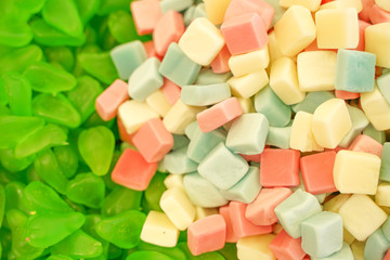 delicious multi-colored fruit marmalade. unhealthy bright candies in bulk. different jelly photo close. tasty sweets in the candy shop. nobody. 