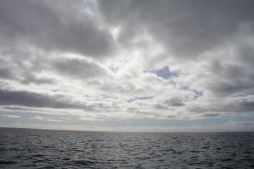 Sunlit clouds over the ocean