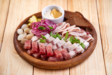 meat appetizer on the wooden background