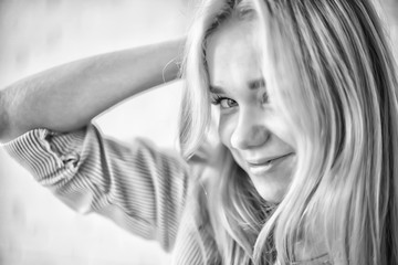 cute blonde black and white / portrait of a beautiful adult blonde girl in vintage style black and...