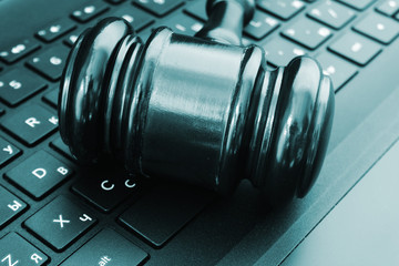 Obraz na płótnie Canvas Cyber law or crime concept, judge gavel on computer