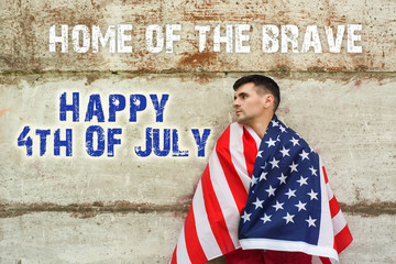 Happy 4th of July Independence Day America! young man proudly hold waving american USA flag