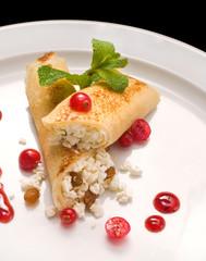 Thin pancakes with cottage cheese and jam. Healthy traditional breakfast concept. close up