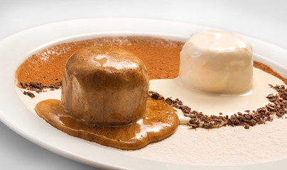 Yin Yang decoration of chocolate and vanilla ice cream on a white plate