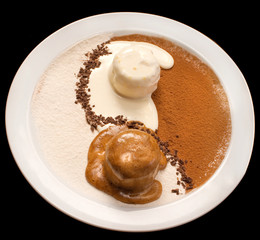 Yin Yang decoration of chocolate and vanilla ice cream on a white plate