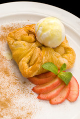 photo of delicious puff pastry with berries and ice cream on a white plate