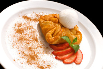 photo of delicious puff pastry with berries and ice cream on a white plate