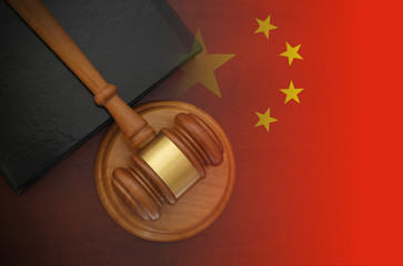 Gavel and legal book on wooden table, collage with flag of China