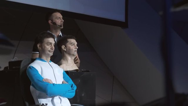 Humanoid robot man on stage. Innovative development in robotics and artificial intelligence. Android Presentation. Modern Robotic Technologies. The robot shows emotions.