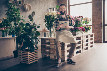 Full length body size view photo cute charming lovely freelancer hold hadn device use user upload information smm website botanical flora florist floristry wear checked shirt trousers floor sneakers