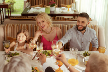 Girl celebrating wedding of grandmother with parents