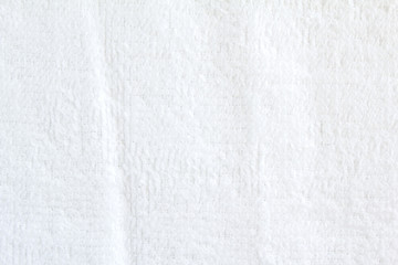 Closeup white crumpled soft terry towel texture background.