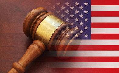 usa legal concept, judge wooden gavel on table and flag of United States