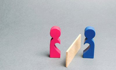 A couple of lovers divided barrier. Concept of breaking relationships, parting and quarrel. Family psychologist services. Divorce and division of property. Minimalism. Love at a distance