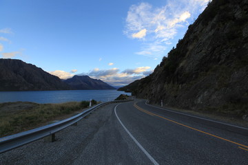 Fototapeta premium calmly on the road in morning with mountain and blue sky background in newzealand