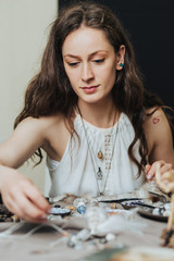 Artisan woman making handmade gemstone jewelry