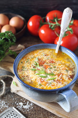 Stracciatella tomato soup: parsley, eggs and parmesan cheese