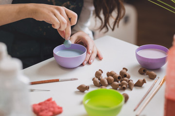 Artisan woman making handmade gemstone jewelry
