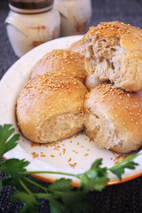 Fresh homemade sourdough bread buns with sesame