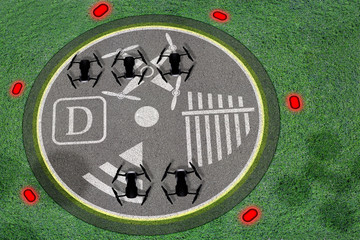 Drone landing site. Concept of drone’s port or spot or desk to operate UAV. Concrete with marks for unmanned aerial vehicle flights. Perspective view from the sky with shadows and silhouettes