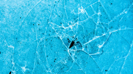View of beautiful drawings on ice from cracks. A tiny world in the largest one