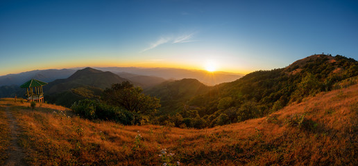 Panorama photo. Scenic sunset and mountain view between the hiking route to Doi pui ko, Mae hong son, Thailand.