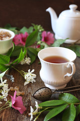 Decorative composition of vintage style: romantic tea drinking with jasmine tea