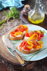 Vegetable appetizer. Slice of bread, cream cheese and grilled bell pepper with olive oil