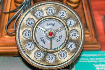 detail of old wood and copper telephone