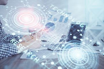 Double exposure of tech drawings with hands working on computer background. Concept of innovation.