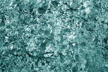 Old stone surface in cyan tone.