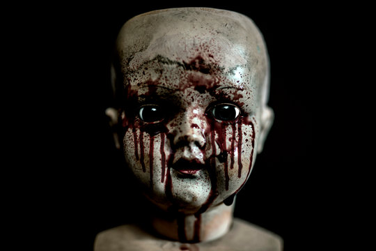Creepy bloody doll in the dark 