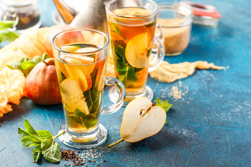 Hot fruit tea with ripe pears and mint