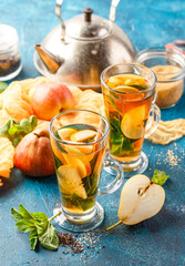 Hot fruit tea with ripe pears and mint