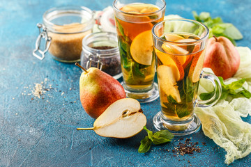 Hot fruit tea with ripe pears and mint