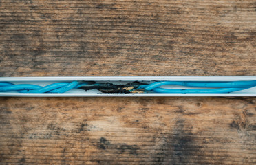 Short circuit, burnt cable on wooden construction. fire wiring. faulty cable