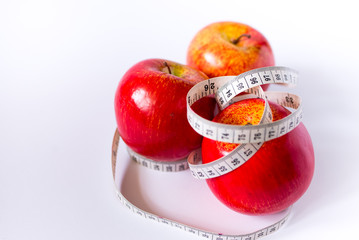 red apple and measure tape