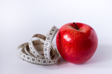 apple with measuring tape isolated on white