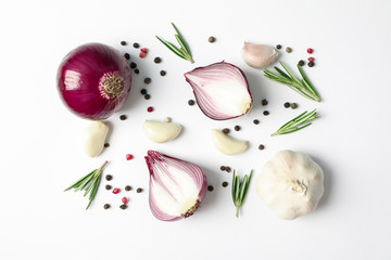 Flat lay composition with red onion and spices on white background