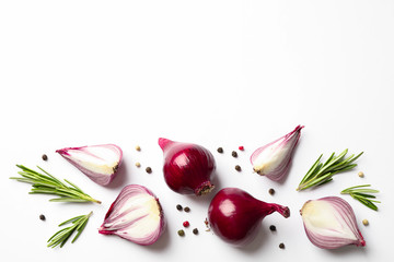 Flat lay composition with red onion and spices on white background