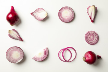 Flat lay composition with red onion on white background